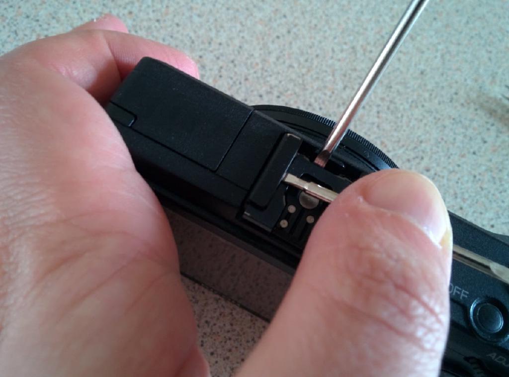 Slide hotshoe spring back